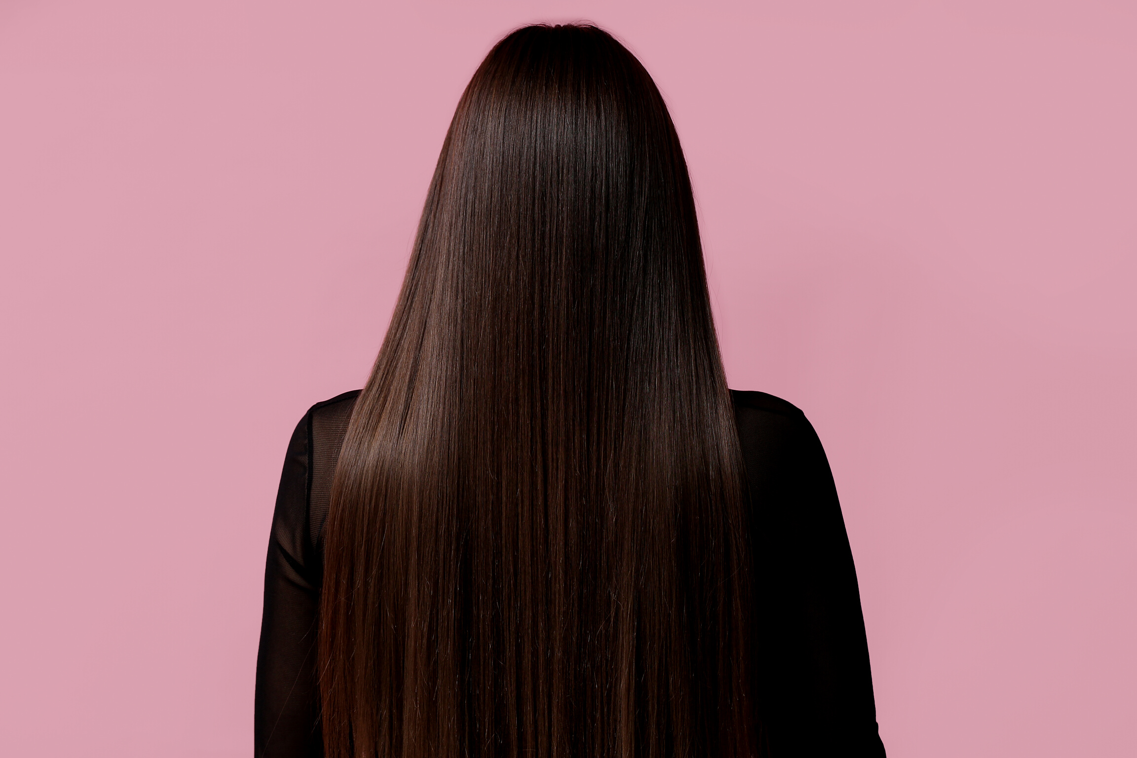 Woman with Straight Hair on Pink Background